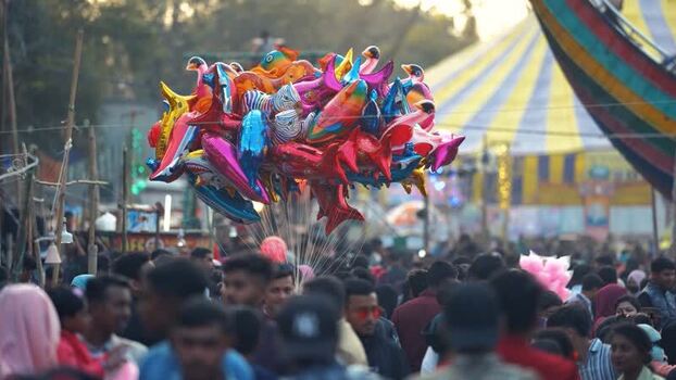 View of colorful balloons over a crowded fair Bangladesh. View of colorful balloons over a crowded fair Bangladesh.