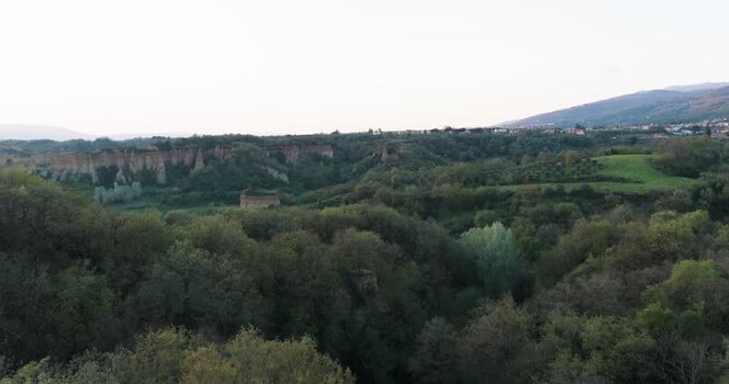 Aerial view of the Balze del Valdarno erosion cliffs and lush forest Italy. Aerial view of the Balze del Valdarno erosion cliffs and lush forest Italy.
