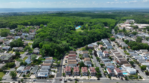 Aerial view of the Staten Island Greenbelt surrounded by residential houses and lush forest in New York New York United States.