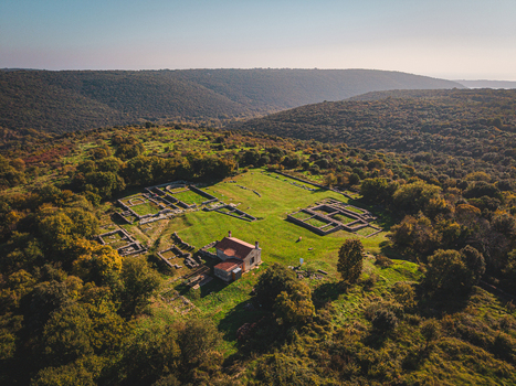 Aerial view of the ancient Roman ruins nestled amidst lush greenery a testament to history s embrace by nature Pula Istria County Croatia.