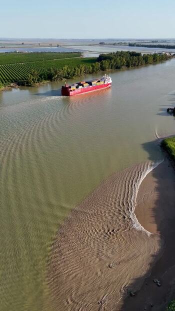 Aerial view of a cargo ship on the Guadalquivir river Spain.
