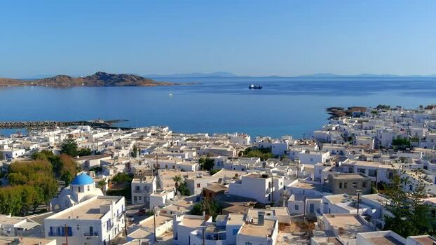 Aerial view of white buildings and blue domed church Greece. Aerial view of white buildings and blue domed church Greece.