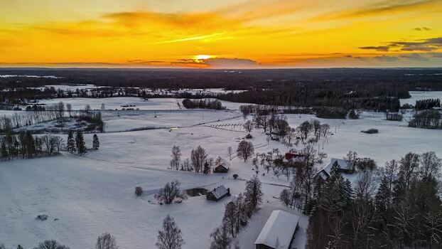 Aerial view of snowy rural landscape at sunset Latvia. Aerial view of snowy rural landscape at sunset Latvia.
