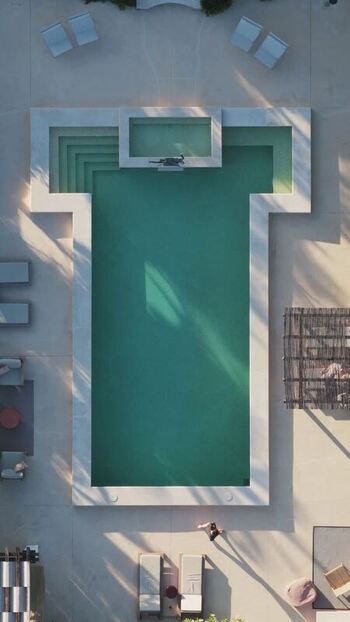 Aerial view of a modern geometric swimming pool Spain.