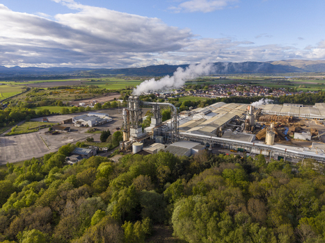 Cowie United Kingdom 06 May 2026 Aerial view of the industrial timber processing plant with smoke rising from chimneys surrounded by lush green forests and rolling hills. Cowie United Kingdom 06 May 2026 Aerial view of the industrial timber processing plant with smoke rising from chimneys surrounded by lush green forests and rolling hills.