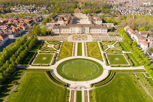 Aerial view of Ludwigsburg Palace with its baroque architecture formal gardens circular fountain and surrounding urban landscape in Ludwigsburg Baden Wurttemberg Germany.