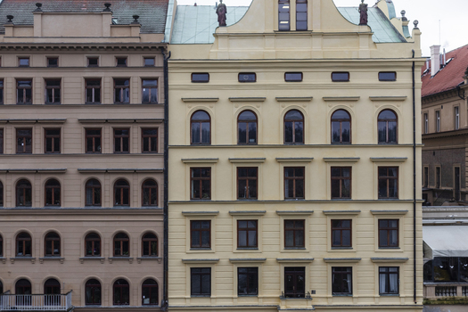 View of historic building facades with ornate architectural details and arched windows Prague Prague Czechia. View of historic building facades with ornate architectural details and arched windows Prague Prague Czechia.
