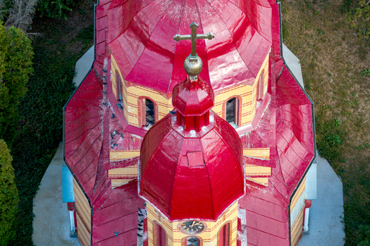 Crvena Crkva Vojvodina Serbia 29 September 2026 Aerial view of the Church of the Annunciation of the Blessed Virgin Mary with its distinctive red domes golden cross and brick facade.
