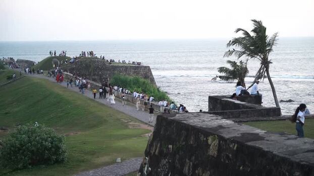 View of Galle Fort ramparts with people by the sea Sri Lanka. View of Galle Fort ramparts with people by the sea Sri Lanka.