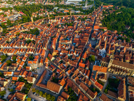 Aerial view of the historic medieval town with its dense red tiled rooftops and winding streets in Rothenburg ob der Tauber Bavaria Germany. Aerial view of the historic medieval town with its dense red tiled rooftops and winding streets in Rothenburg ob der Tauber Bavaria Germany.