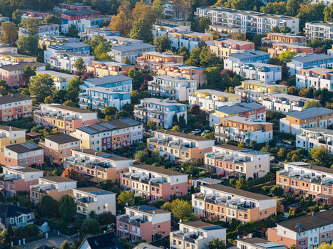 Aerial view of the residential buildings in the Schweizer Viertel neighborhood with colorful facades and lush green trees in Berlin Berlin Germany. Aerial view of the residential buildings in the Schweizer Viertel neighborhood with colorful facades and lush green trees in Berlin Berlin Germany.