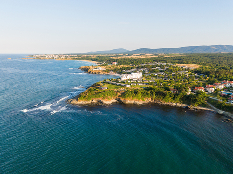 Aerial view of the coastal resort area with green hills rocky cliffs and sandy beaches along the Black Sea in Lozenets Burgas Bulgaria.