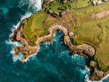 Aerial view of the rugged coastline and crashing waves at Devil s Tears on the island of Nusa Lembongan Bali Indonesia. Aerial view of the rugged coastline and crashing waves at Devil s Tears on the island of Nusa Lembongan Bali Indonesia.