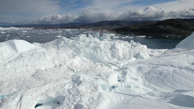 Aerial view of Ilulissat Icefjord in Greenland. Aerial view of Ilulissat Icefjord in Greenland.