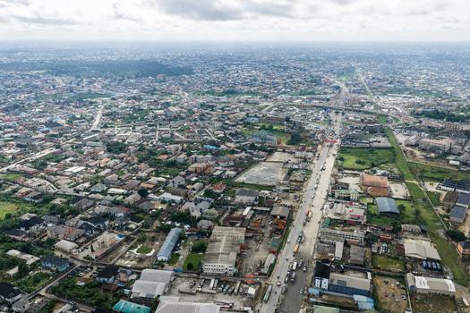 Port Harcourt Nigeria 03 July 2026 Aerial view of the sprawling urban landscape of Port Harcourt featuring dense residential areas industrial zones and a major road artery under a cloudy sky. Port Harcourt Nigeria 03 July 2026 Aerial view of the sprawling urban landscape of Port Harcourt featuring dense residential areas industrial zones and a major road artery under a cloudy sky.