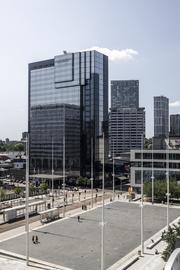 Aerial view of the Hyatt Regency Birmingham hotel overlooking Centenary Square with modern glass architecture tram tracks and pedestrians in Birmingham England United Kingdom.