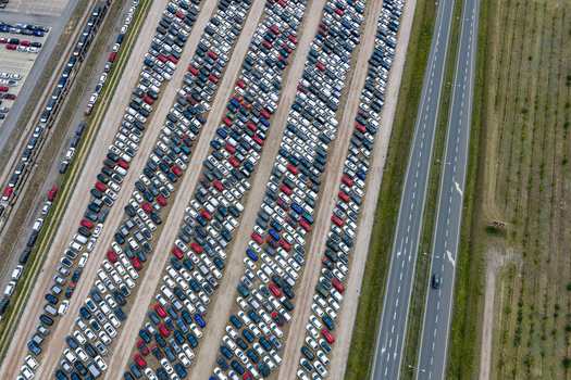 Aerial view of car forwarding facility with rows of parked new vehicles in Mszczonow Masovian Voivodeship Poland.