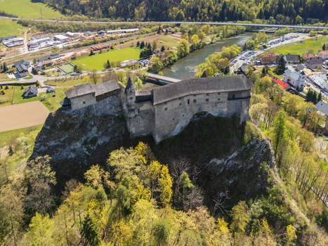 Aerial view of Orava Castle perched on a steep rock cliff overlooking the Orava river and surrounding green landscape in Dolny Kubin Zilinsky kraj Slovakia. Aerial view of Orava Castle perched on a steep rock cliff overlooking the Orava river and surrounding green landscape in Dolny Kubin Zilinsky kraj Slovakia.