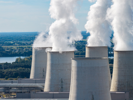 Aerial view of the Janschwalde Power Station cooling towers emitting steam during the transition from coal to sustainable energy in Peitz Brandenburg Germany. Aerial view of the Janschwalde Power Station cooling towers emitting steam during the transition from coal to sustainable energy in Peitz Brandenburg Germany.
