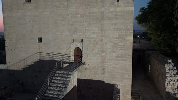 Aerial view of historic stone fortification tower in Cyprus.