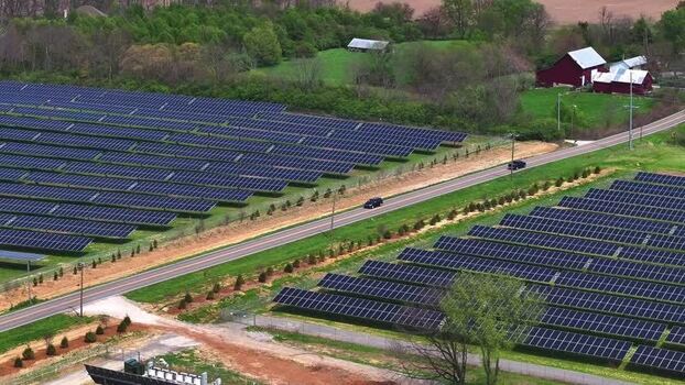 Aerial view of solar panels in field United States.