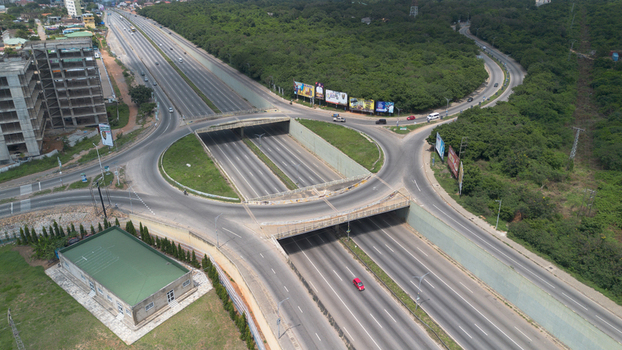 Aerial view of the Achimota old overhead interchange featuring multi lane highways concrete overpasses and surrounding greenery in Accra Greater Accra Region Ghana.