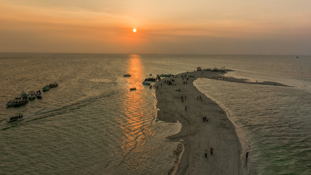 Aerial view of Gusung Sanggalau Sandbar surrounded by turquoise waters and coral reefs in the Derawan Islands Kecamatan Pulau Derawan Kalimantan Timur Indonesia. Aerial view of Gusung Sanggalau Sandbar surrounded by turquoise waters and coral reefs in the Derawan Islands Kecamatan Pulau Derawan Kalimantan Timur Indonesia.