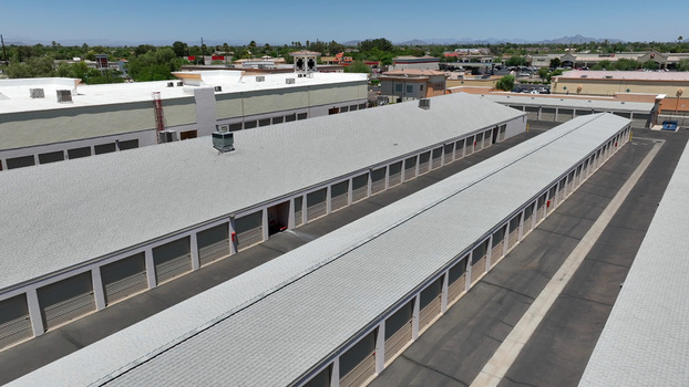 Aerial view of a self storage facility with long rows of units and grey roofs in Glendale Arizona United States. Aerial view of a self storage facility with long rows of units and grey roofs in Glendale Arizona United States.