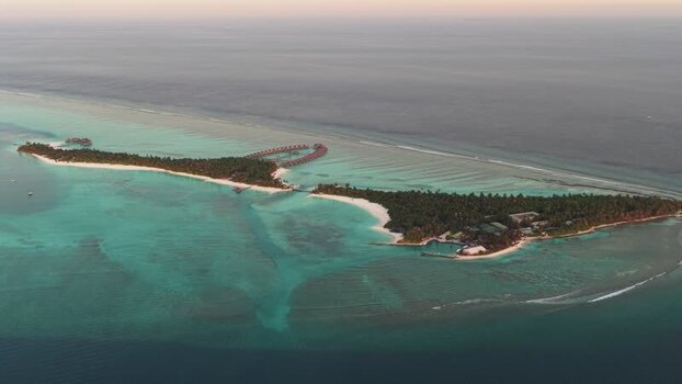 Aerial view of a tropical island resort in Kudahuvadhoo Maldives. Aerial view of a tropical island resort in Kudahuvadhoo Maldives.