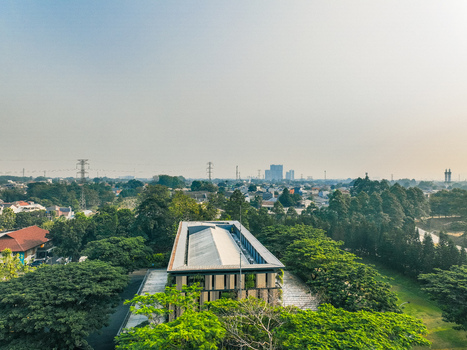 Aerial view of The Pavilion Venue surrounded by lush green trees and suburban houses in Kecamatan Ciputat Timur Banten Indonesia. Aerial view of The Pavilion Venue surrounded by lush green trees and suburban houses in Kecamatan Ciputat Timur Banten Indonesia.