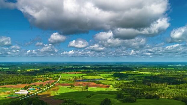 Aerial view of lush green fields and forests in Latvia. Aerial view of lush green fields and forests in Latvia.