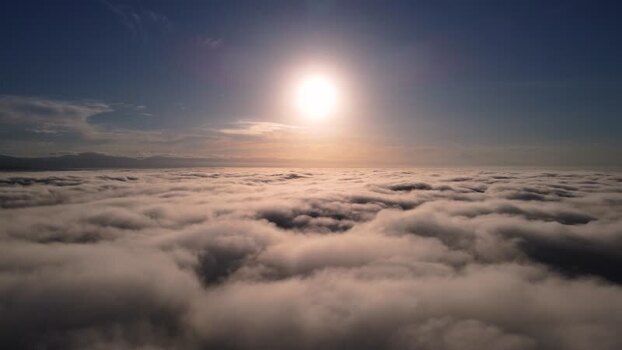 Aerial view of a sea of clouds at sunrise Indonesia.