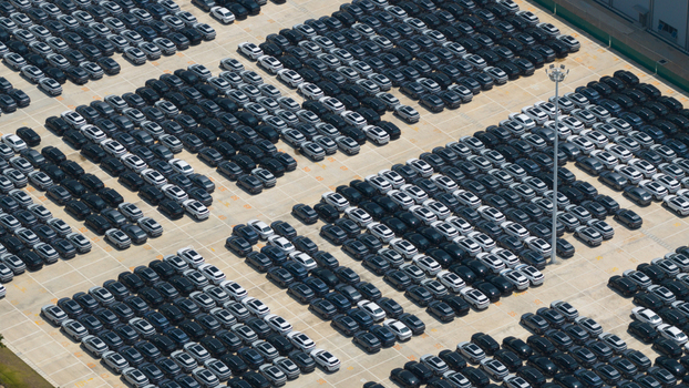Aerial view of rows of new electric vehicles parked at the BYD Thailand Rayong Office Building under bright daylight in Phananikhom Rayong Thailand.