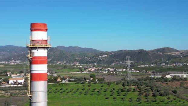 Aerial view of an industrial chimney in Campanillas Spain.