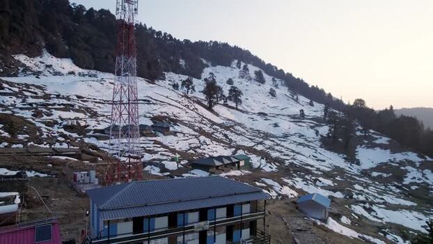 Aerial view of Chopta Tungnath and snowy mountains India.