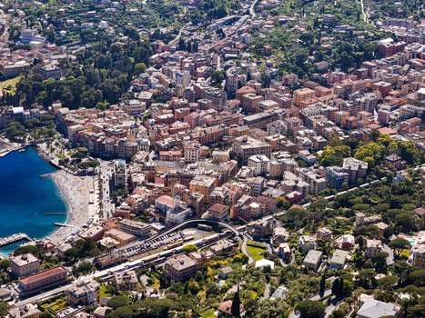 Aerial view of Santa Margherita Ligure with its colorful Mediterranean buildings small sandy beach and lush green hills overlooking the blue sea Santa Margherita Ligure Liguria Italy. Aerial view of Santa Margherita Ligure with its colorful Mediterranean buildings small sandy beach and lush green hills overlooking the blue sea Santa Margherita Ligure Liguria Italy.