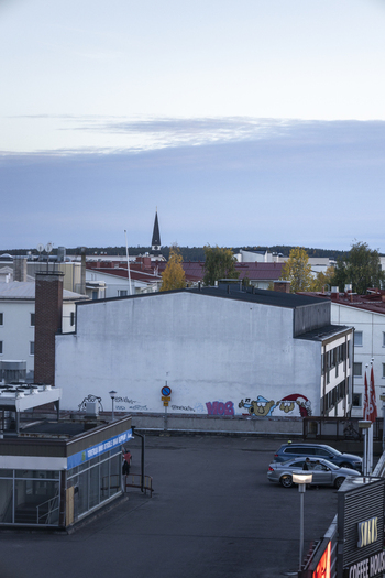 Rovaniemi Finland 19 September 2026 Aerial view of the town of Rovaniemi in Lapland featuring a church spire urban rooftops and a parking area during a clear day.