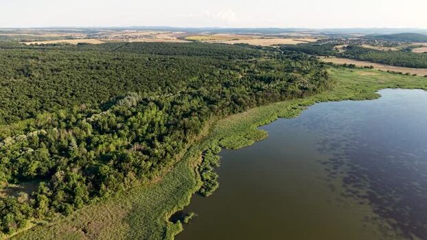 Aerial view of Lake Mandrensko and surrounding forests Bulgaria. Aerial view of Lake Mandrensko and surrounding forests Bulgaria.