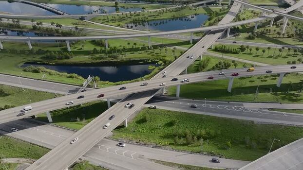 Aerial view of modern highway and vehicles United States.