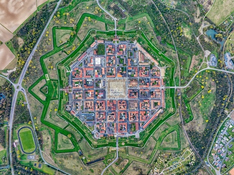 Aerial view of the star shaped fortress city a geometrical masterpiece with its symmetrical layout and vibrant green surroundings Neuf Brisach Grand Est France.
