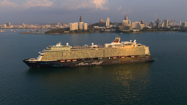 Pattaya City Thailand 06 March 2026 Aerial view of the Mein Schiff 6 cruise ship anchored in the bay with the city skyline and coastal hills in the background at sunset. Pattaya City Thailand 06 March 2026 Aerial view of the Mein Schiff 6 cruise ship anchored in the bay with the city skyline and coastal hills in the background at sunset.