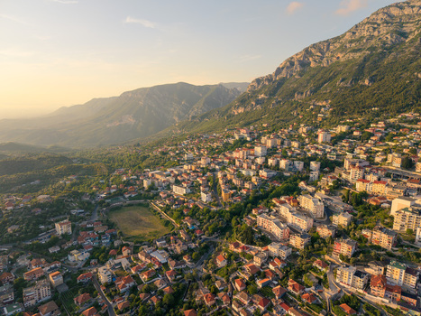 Aerial view of the historic town with residential buildings and rooftops nestled against the steep slopes of the Skanderbeg Mountains Kruje Durres County Albania.