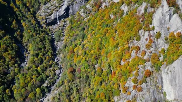 Aerial view of the autumn forest and granite cliffs of Val di Mello Italy. Aerial view of the autumn forest and granite cliffs of Val di Mello Italy.