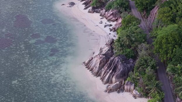 Aerial view of Praslin beach with granite boulders Seychelles.