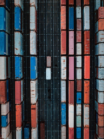 Aerial view of Docklands shipping terminal featuring rows of colorful cargo containers arranged in a grid pattern in Docklands Victoria Australia.