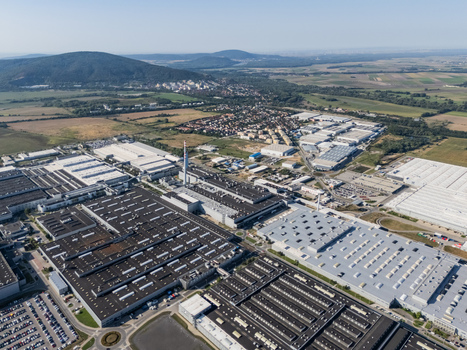 Aerial view of the Volkswagen plant near Devinska Nova Ves with its vast industrial halls and parking lots surrounded by green hills Bratislava Bratislavsky kraj Slovakia. Aerial view of the Volkswagen plant near Devinska Nova Ves with its vast industrial halls and parking lots surrounded by green hills Bratislava Bratislavsky kraj Slovakia.