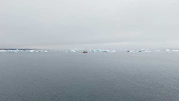 Aerial view of icebergs floating in Disko Bugt Greenland. Aerial view of icebergs floating in Disko Bugt Greenland.