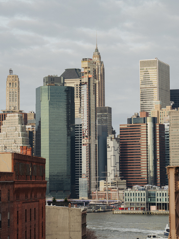View of the Manhattan skyline featuring iconic skyscrapers and modern architecture along the East River in New York New York United States.