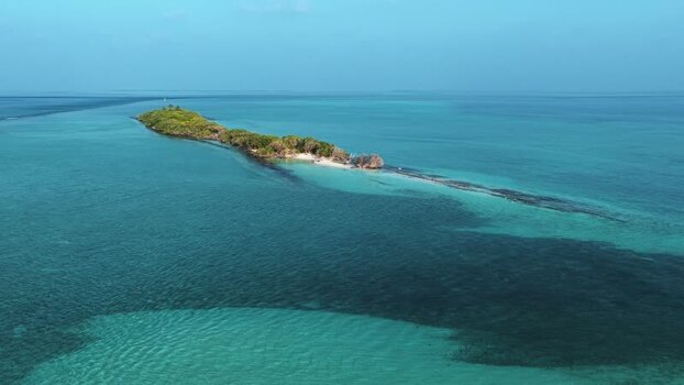 Aerial view of a tropical island and turquoise sea Maldives. Aerial view of a tropical island and turquoise sea Maldives.