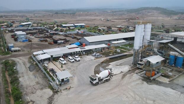 Kecamatan Grogol Jawa Timur Indonesia 17 November 2021 Aerial view of Dhoho International Airport construction site with concrete batching plant machinery and trucks. Kecamatan Grogol Jawa Timur Indonesia 17 November 2021 Aerial view of Dhoho International Airport construction site with concrete batching plant machinery and trucks.